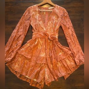 Saints + Secret rust colored lace romper with nude underlay